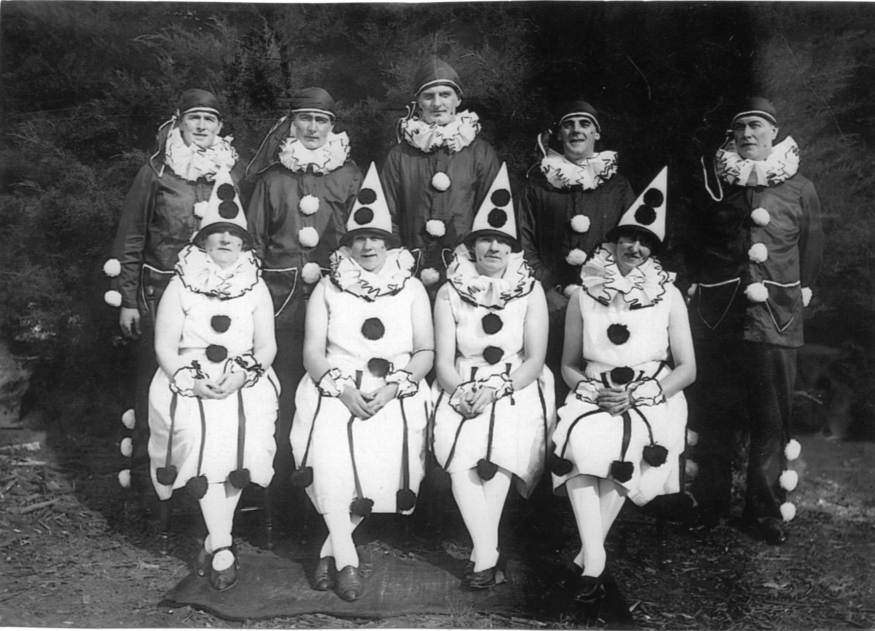 In pantomime costume, Edgar stands at the back far left with Rita sitting in the front row far right, ca 1930.