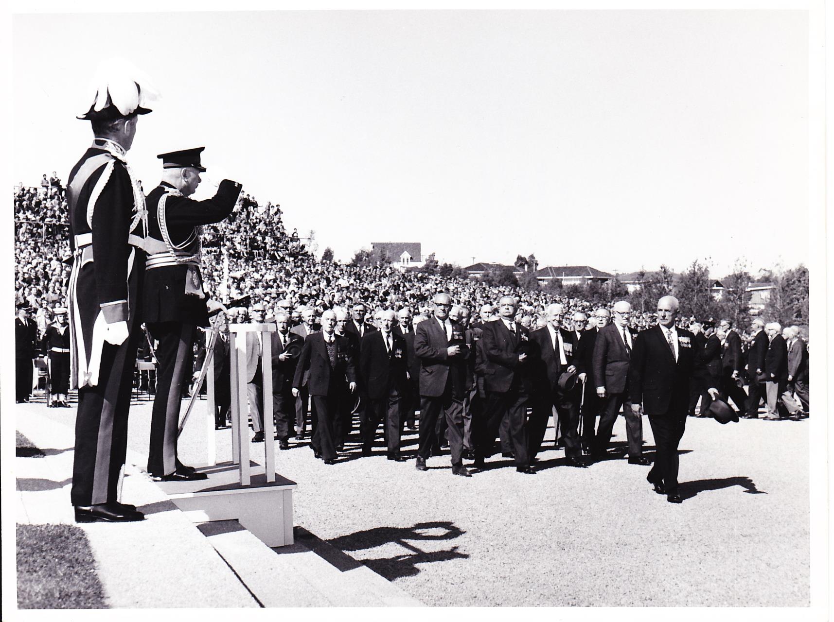 Clive Newman leads the ANZAC day march in Canberra. [ca. 1960]