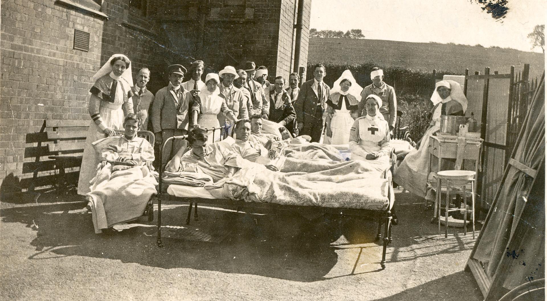 In the second bed from the front, Chris enjoys the sunshine at the 1st Southern General Hospital, Stourbridge 1918.