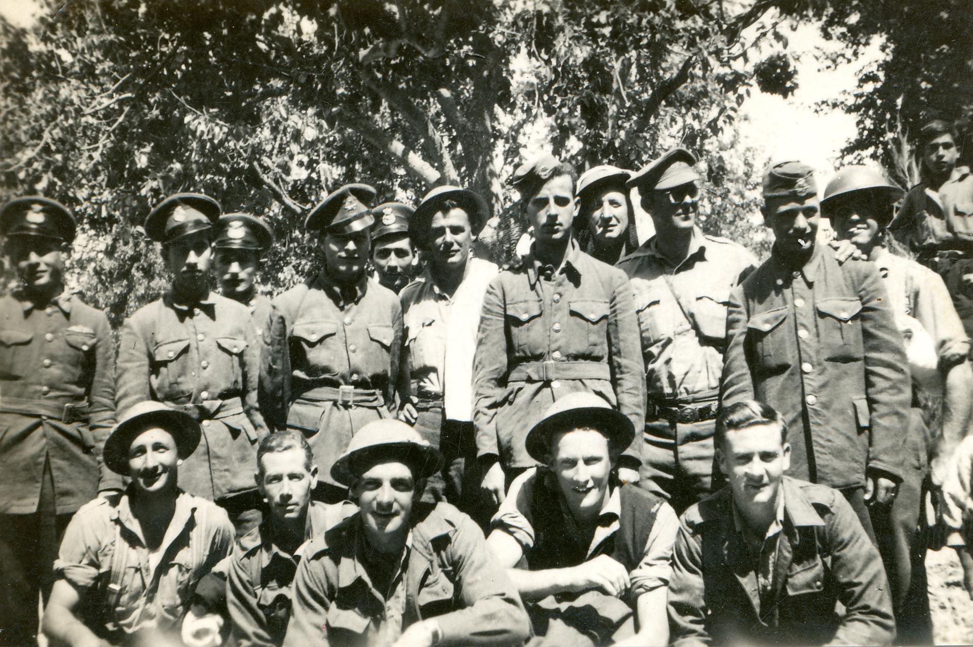 A group photo taken in Crete 1941, Frank stands in the back row, a towel over his helmet.