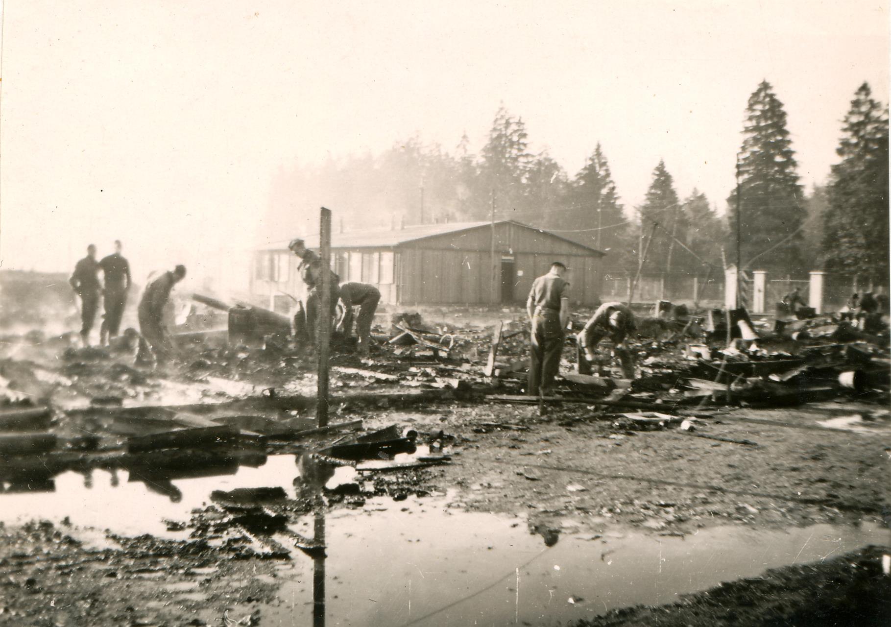 No 1 Barracks of the prisoner of war compound was demolished after an air raid at Waldfriedhof, Germany 1942.