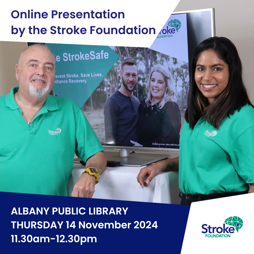 Two people smiling in front of a Stroke Foundation banner